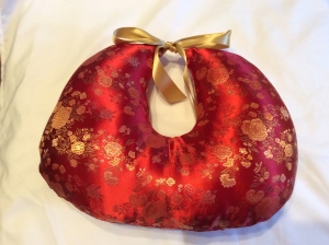 Red Paradise pillow to aid breast cancer recovering